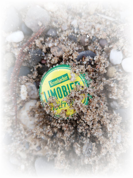 Kronkorken im Rheinsand